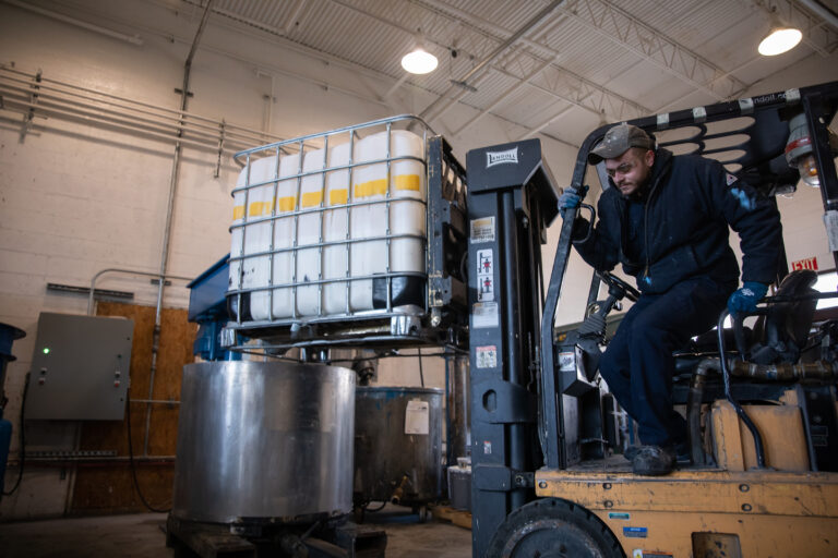 Production adding a tote of ingredients to a batch Production adding a tote of ingredients to a batch