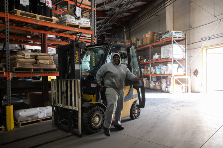 Tow motor driver in the warehouse Tow motor driver in the warehouse