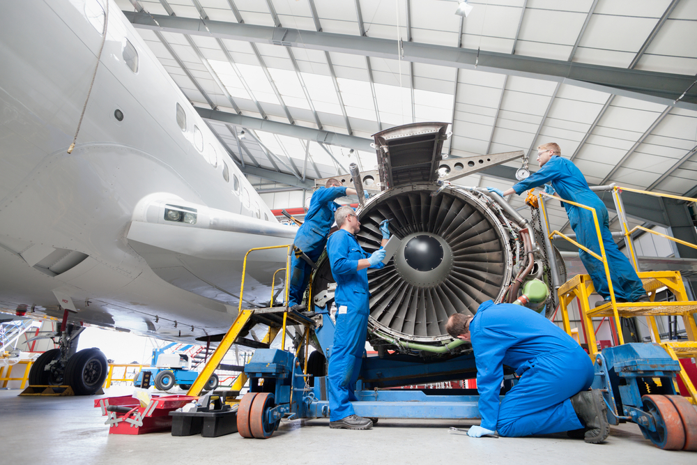 Engineers assembling engine